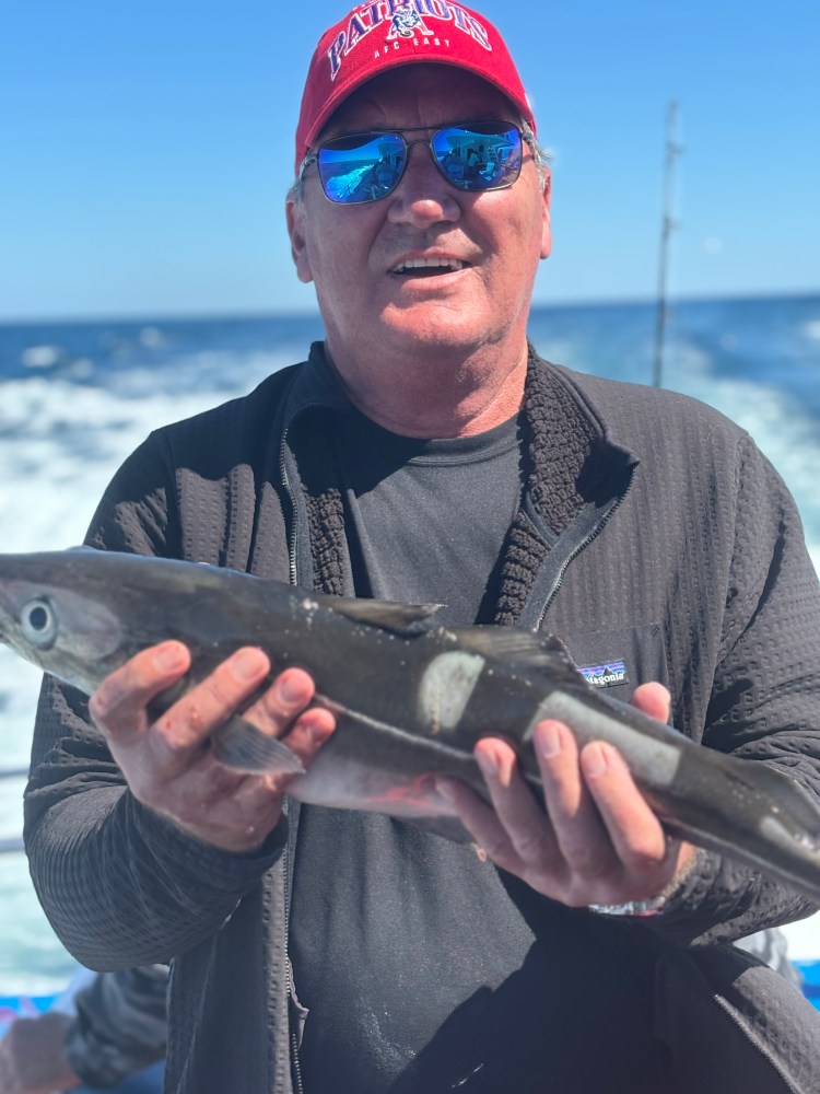 a man holding a fish