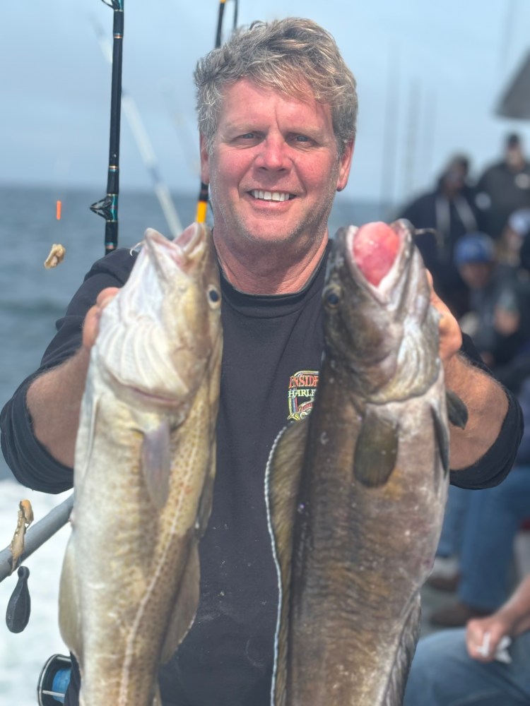 a man holding a fish