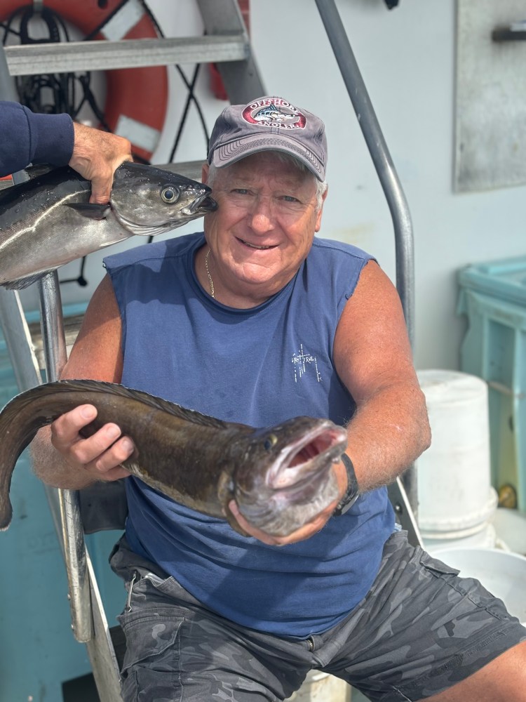 a man holding a fish