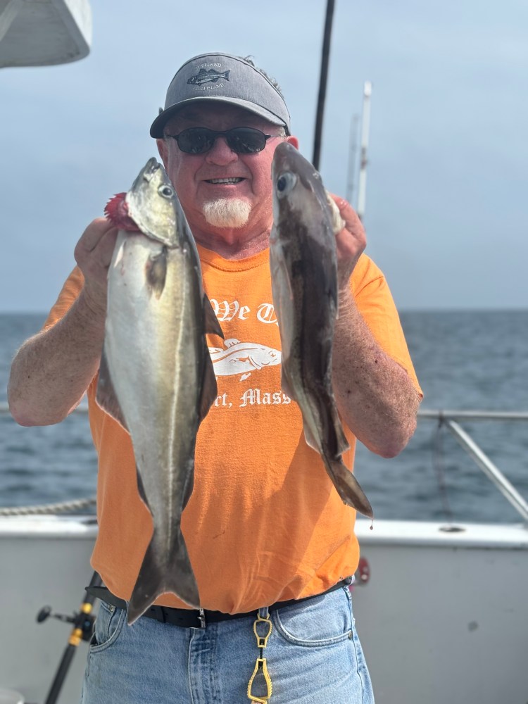 a man holding a fish