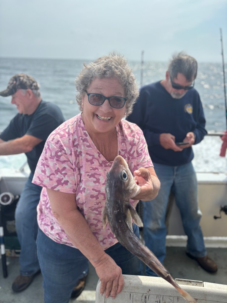 a person holding a fish