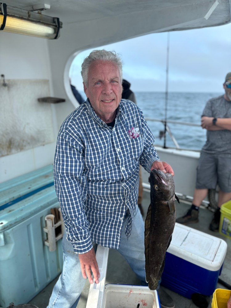 a man holding a fish