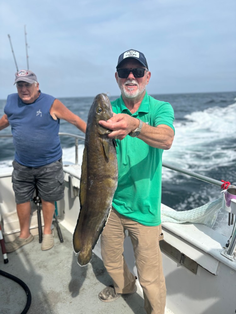 a man holding a fish