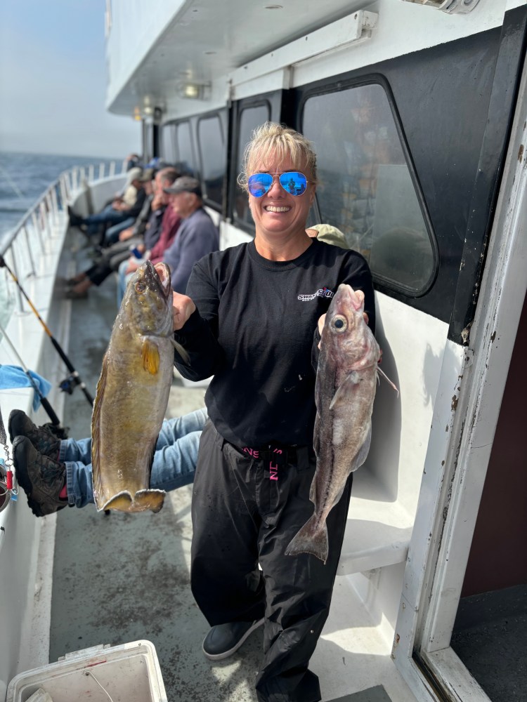 a man holding a fish