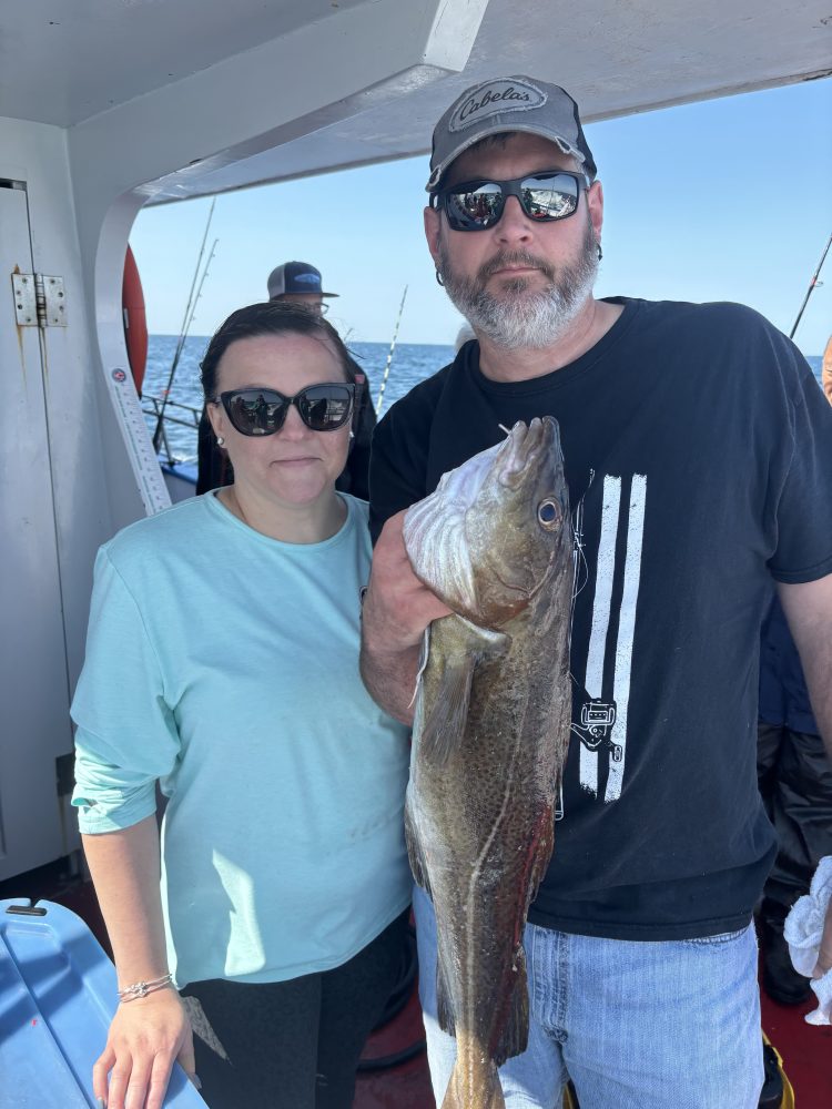 a man holding a fish