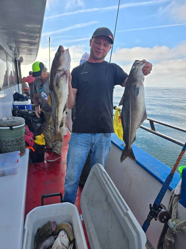 a man holding a fish