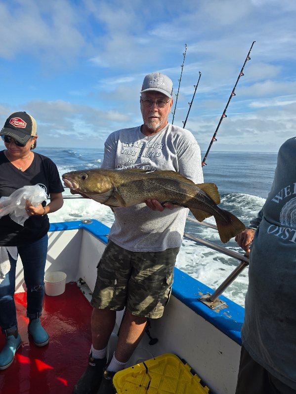 a person holding a fish in the water