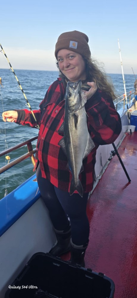 a person standing next to a body of water