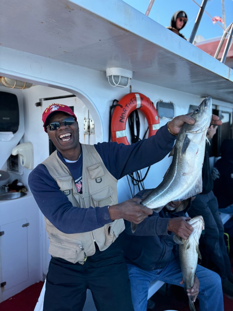 a person holding a fish