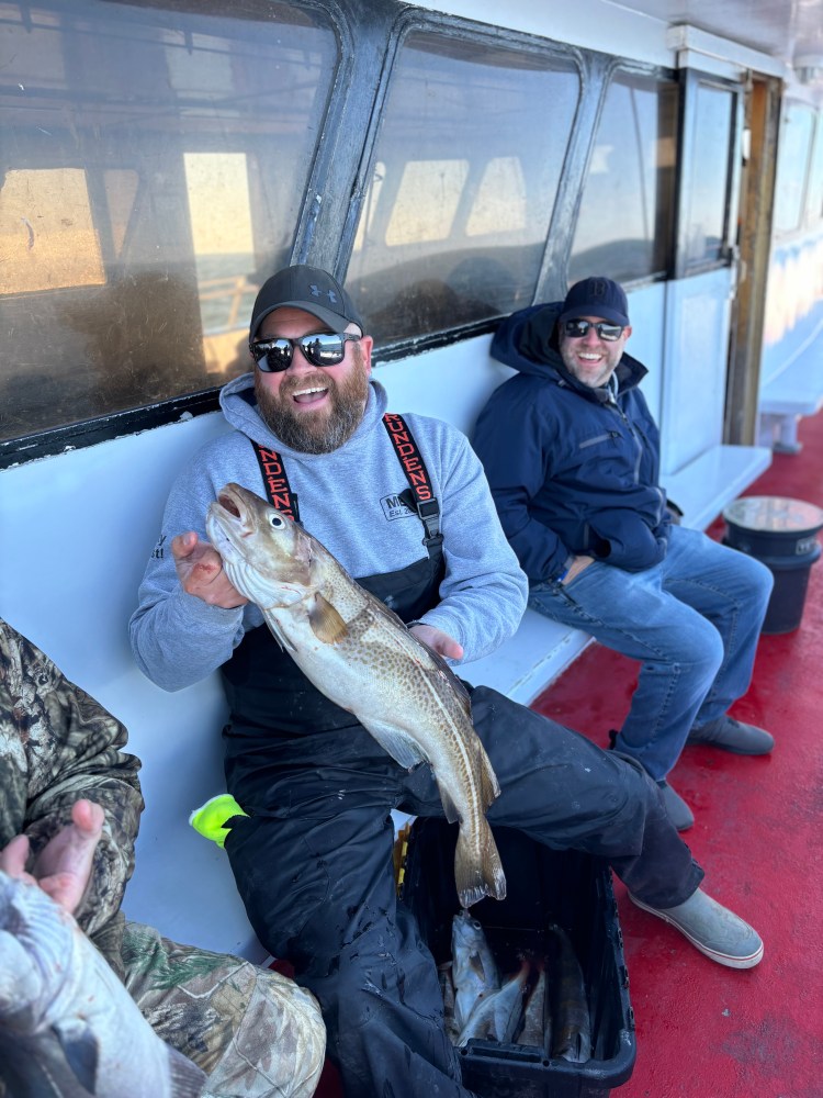 a man holding a fish