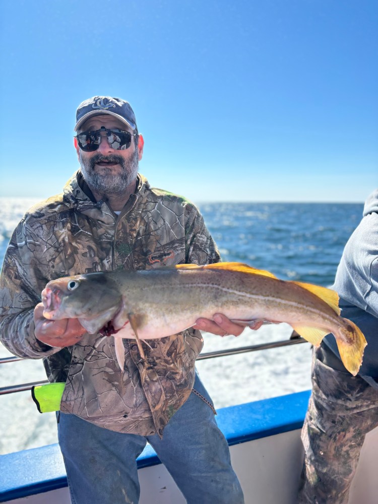 a man holding a fish