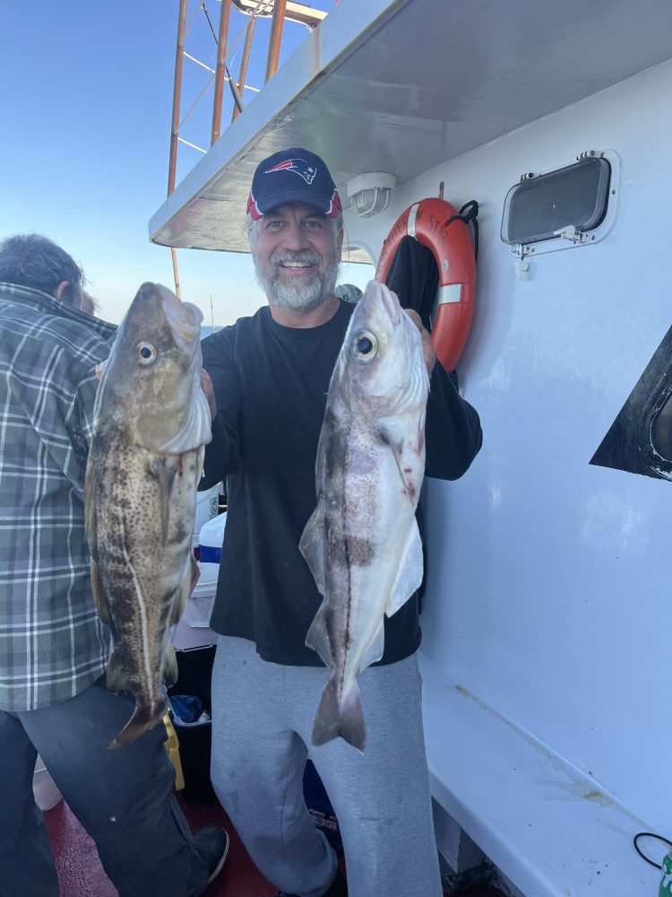 a man holding a fish