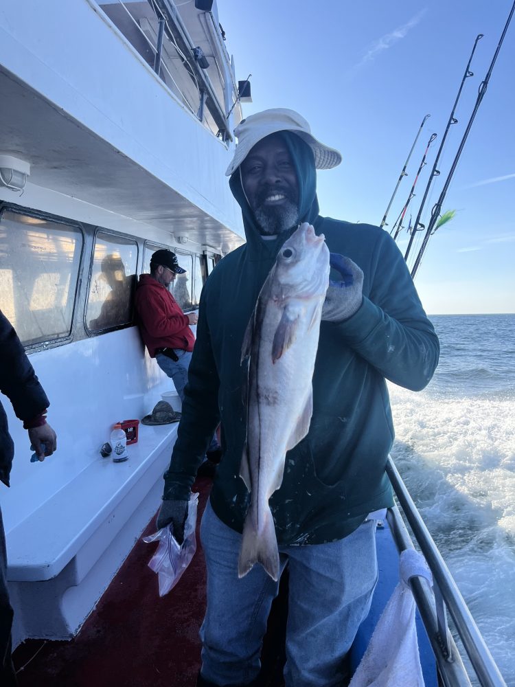 a man holding a fish