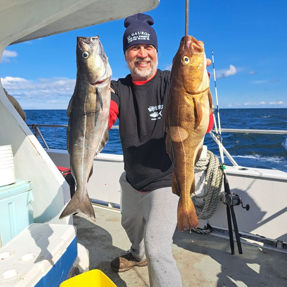 a person holding a fish on a boat