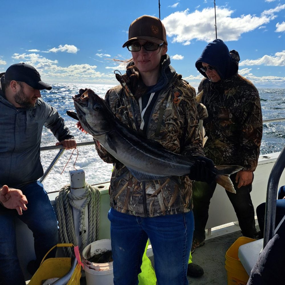 a person holding a fish