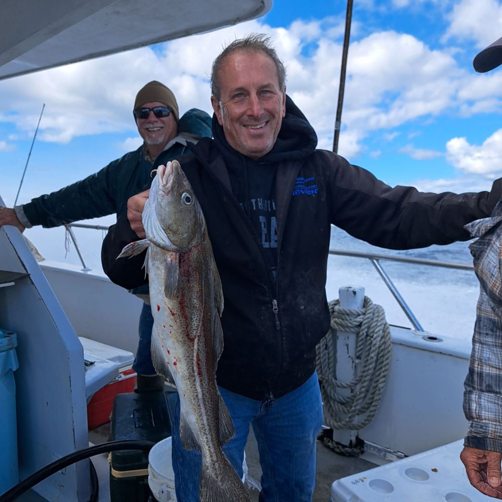 a person holding a fish