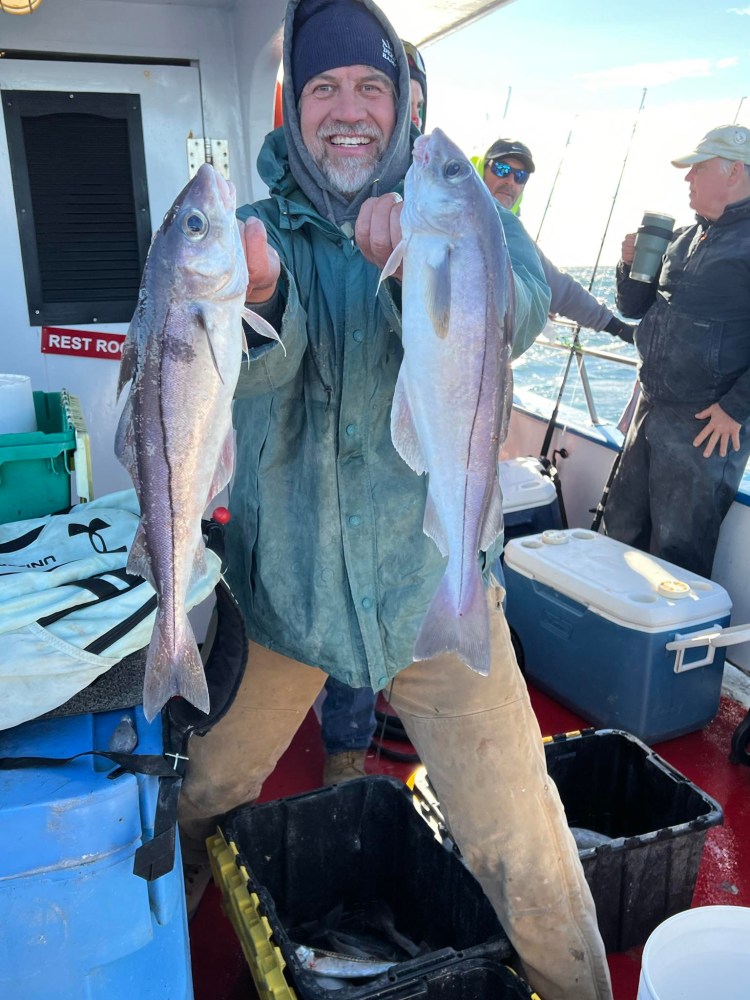 a person holding a fish