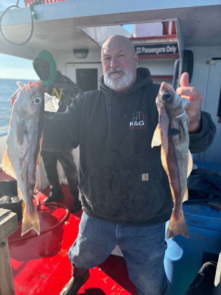 a man holding a fish