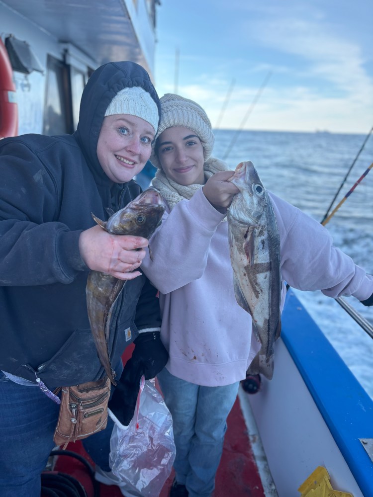 a person holding a fish