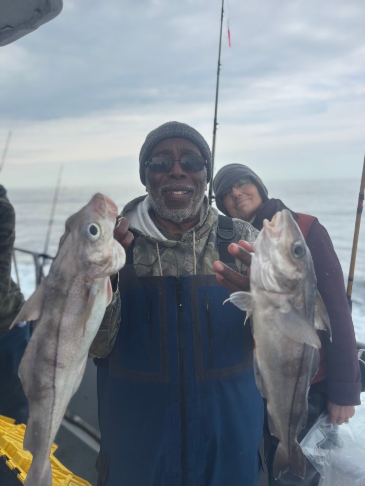 a man holding a fish