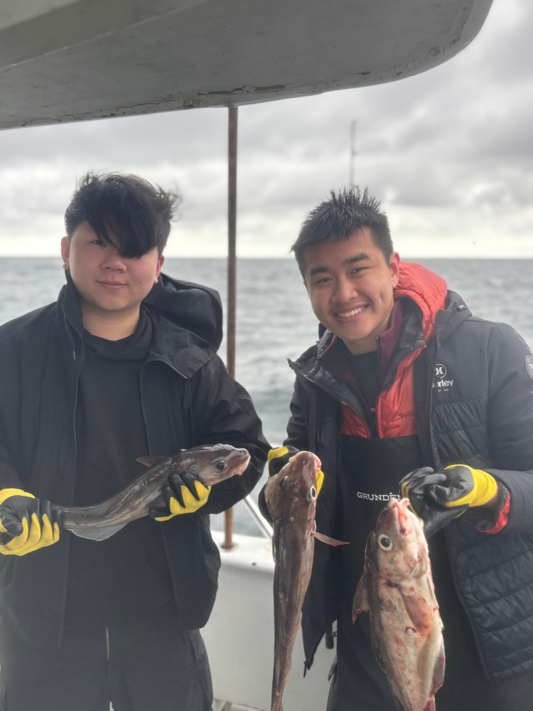 a person holding a fish