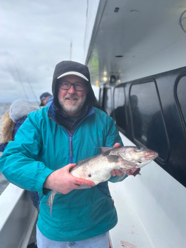 a man holding a fish