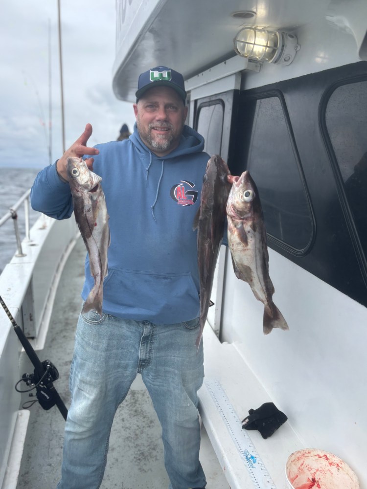 a man holding a fish