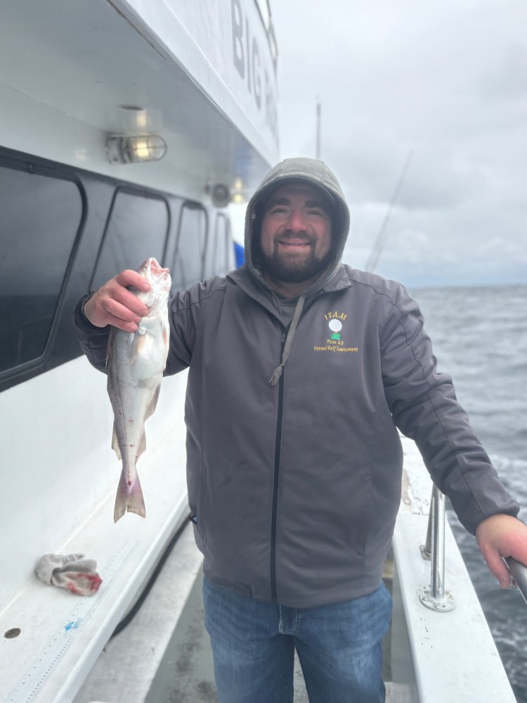 a man holding a fish