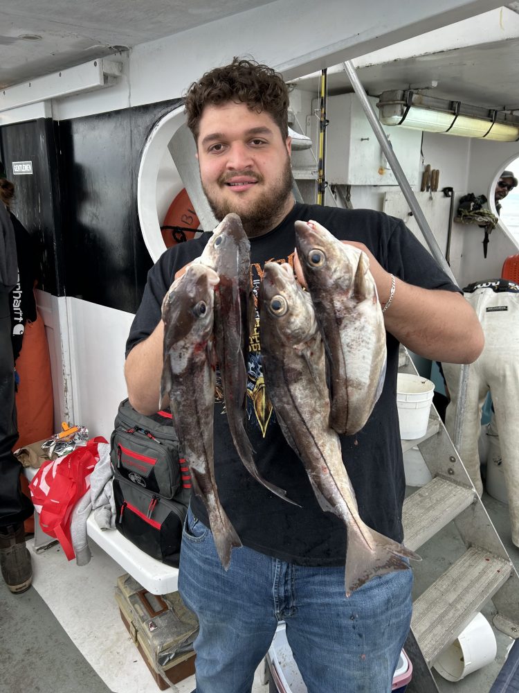 a man holding a fish