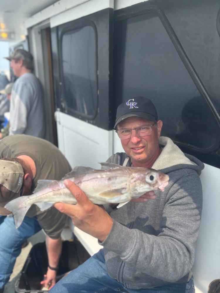 a man holding a fish