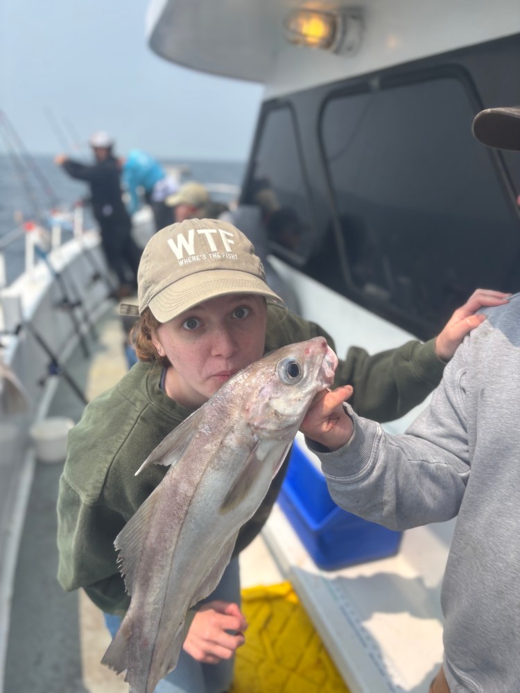 a person holding a fish