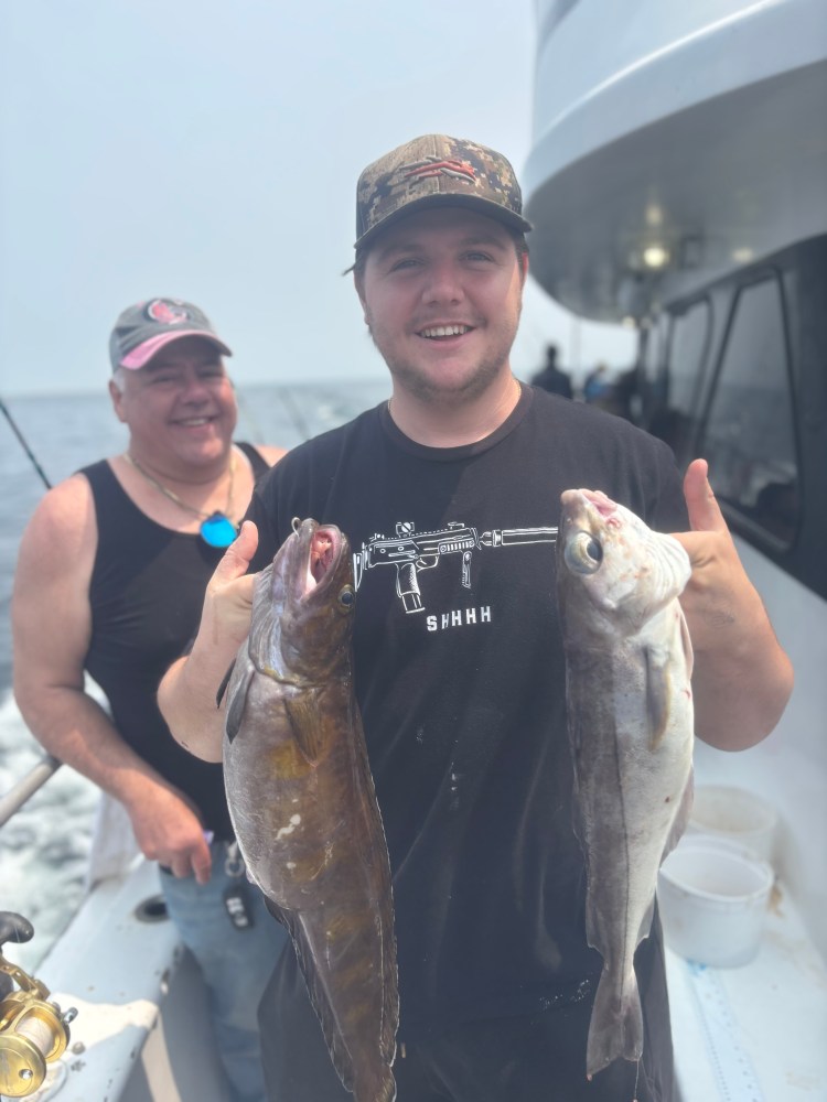 a person holding a fish on a boat