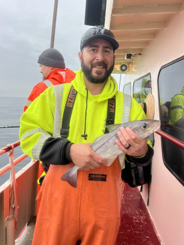 a man holding a fish