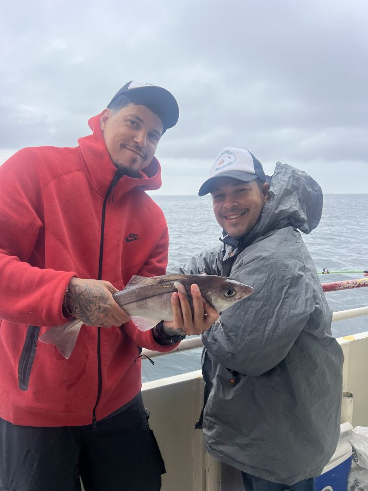 a man holding a fish