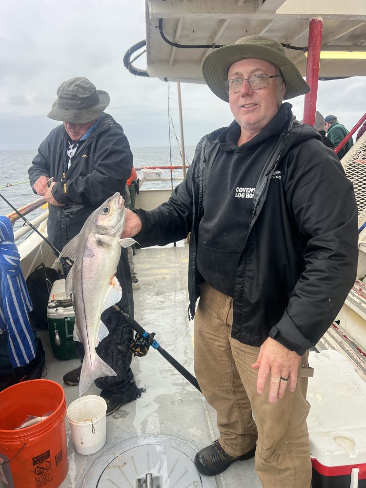 a person holding a fish