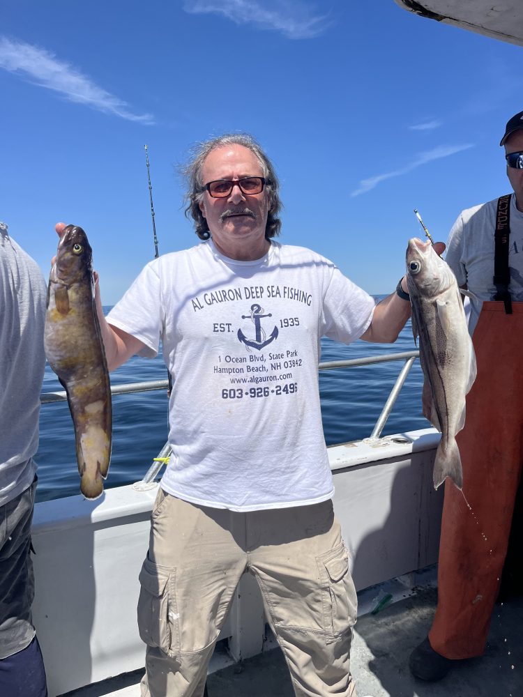 a man holding a fish