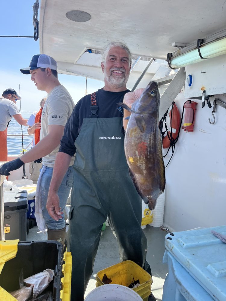 a person holding a fish