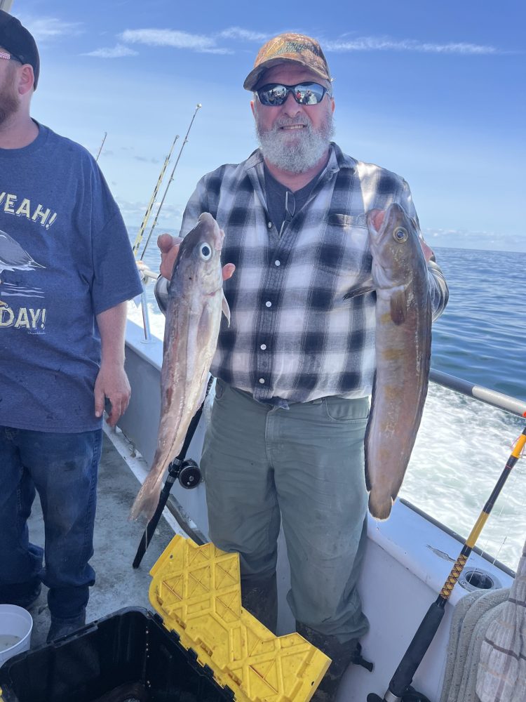 a man holding a fish