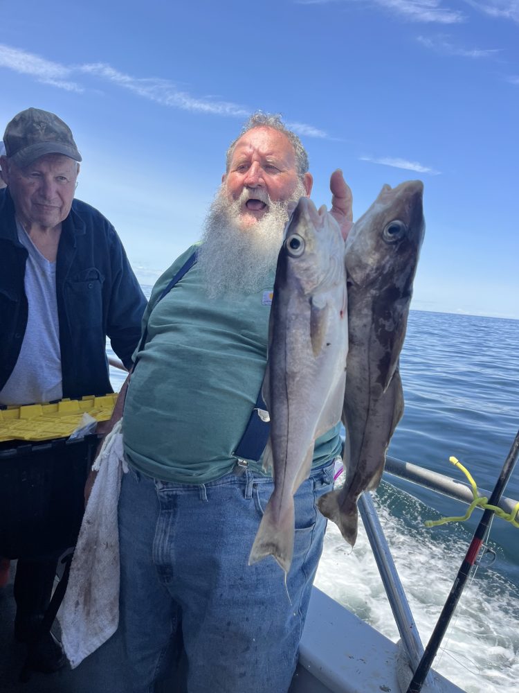 a person holding a fish