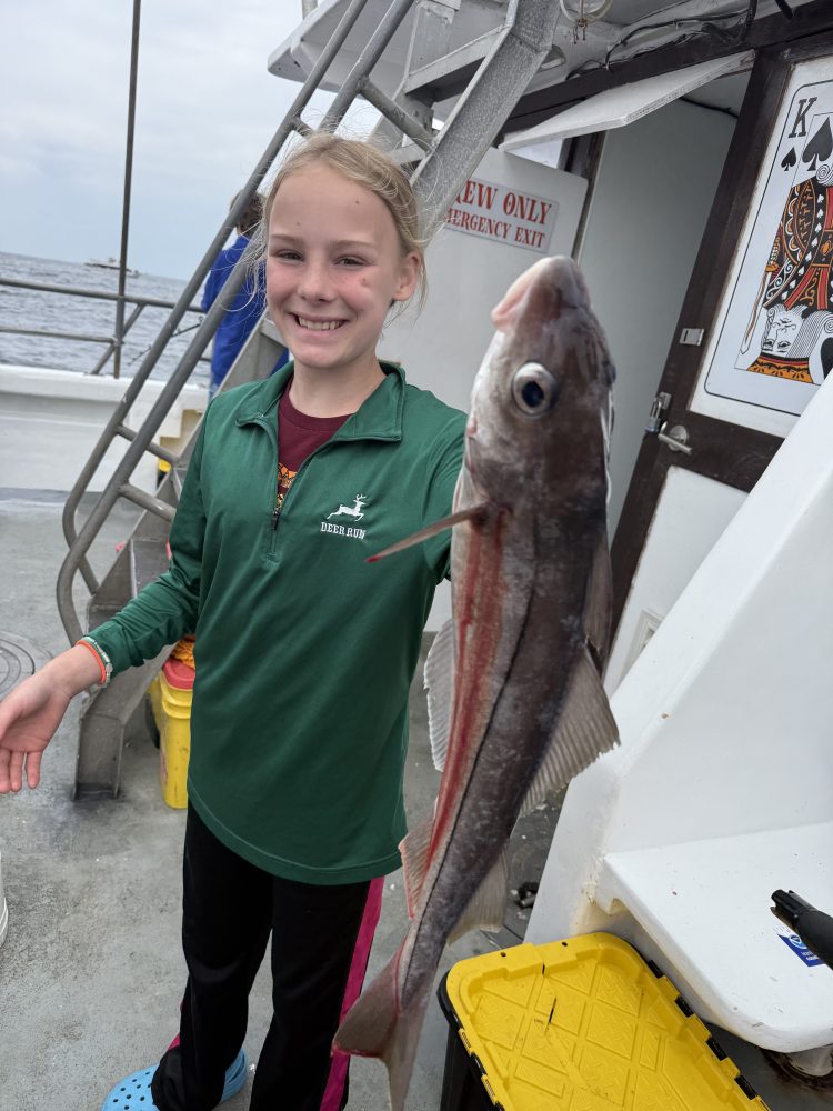 a person holding a fish