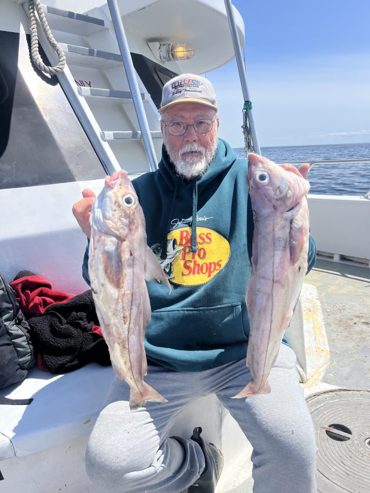 a person holding a fish