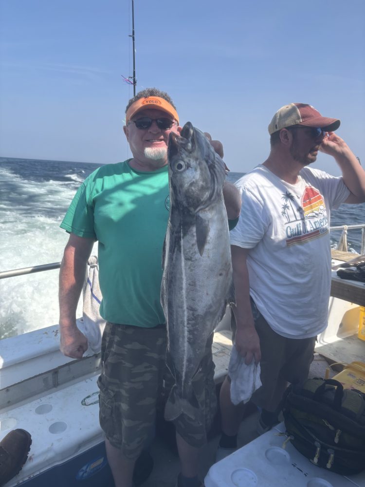 a man holding a fish