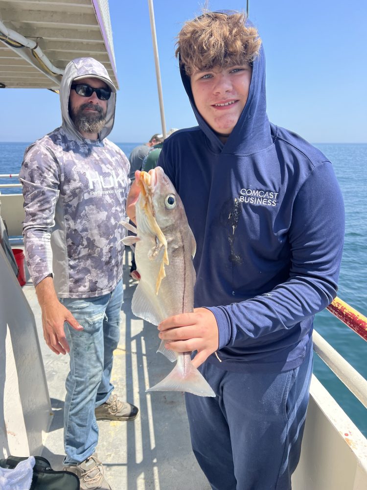 a man holding a fish