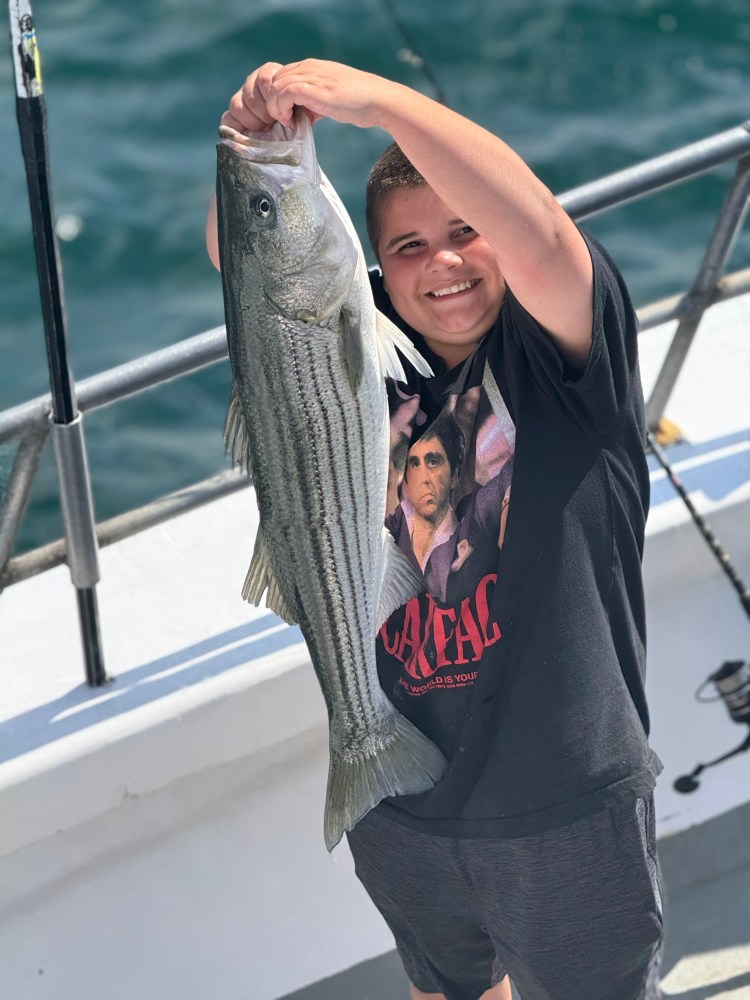 a woman holding a fish