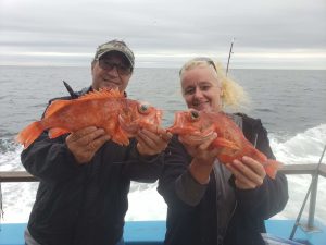 Raymond Floyd holding an animal in a body of water