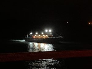 a large bridge lit up at night