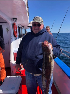 a man holding a fish