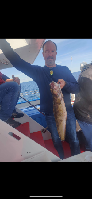 a man holding a fish