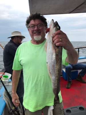 a man holding a fish