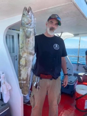 a man holding a fish